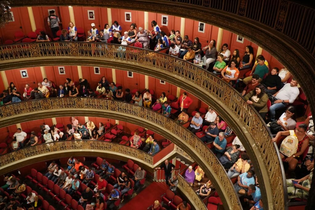 View of audience in Teatro Santa Isabel, Recife, showcasing its elegant architecture and engaged spectators.